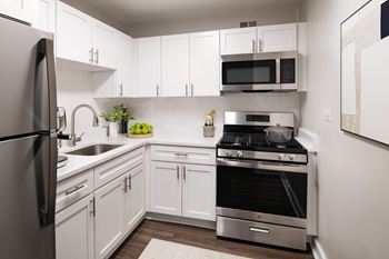 Fully equipped kitchens with dishwashers, microwaves, and ample cabinet space